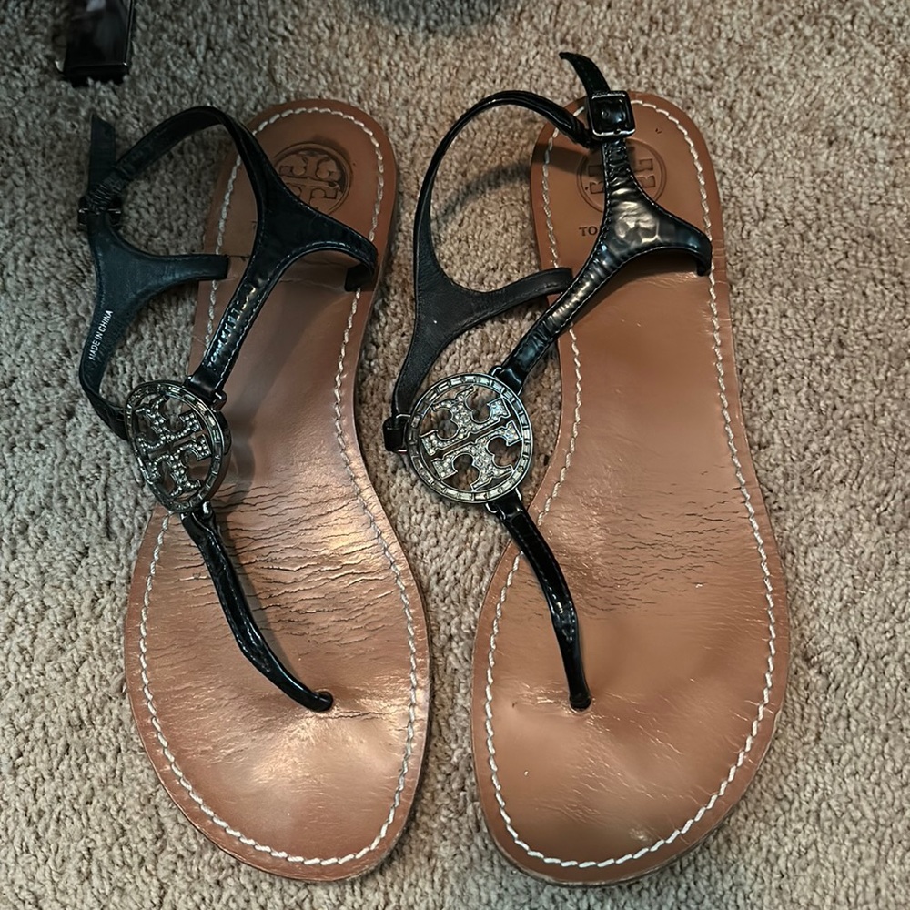 Tory burch black sandals with embezzled logo. Box included. Gently used.